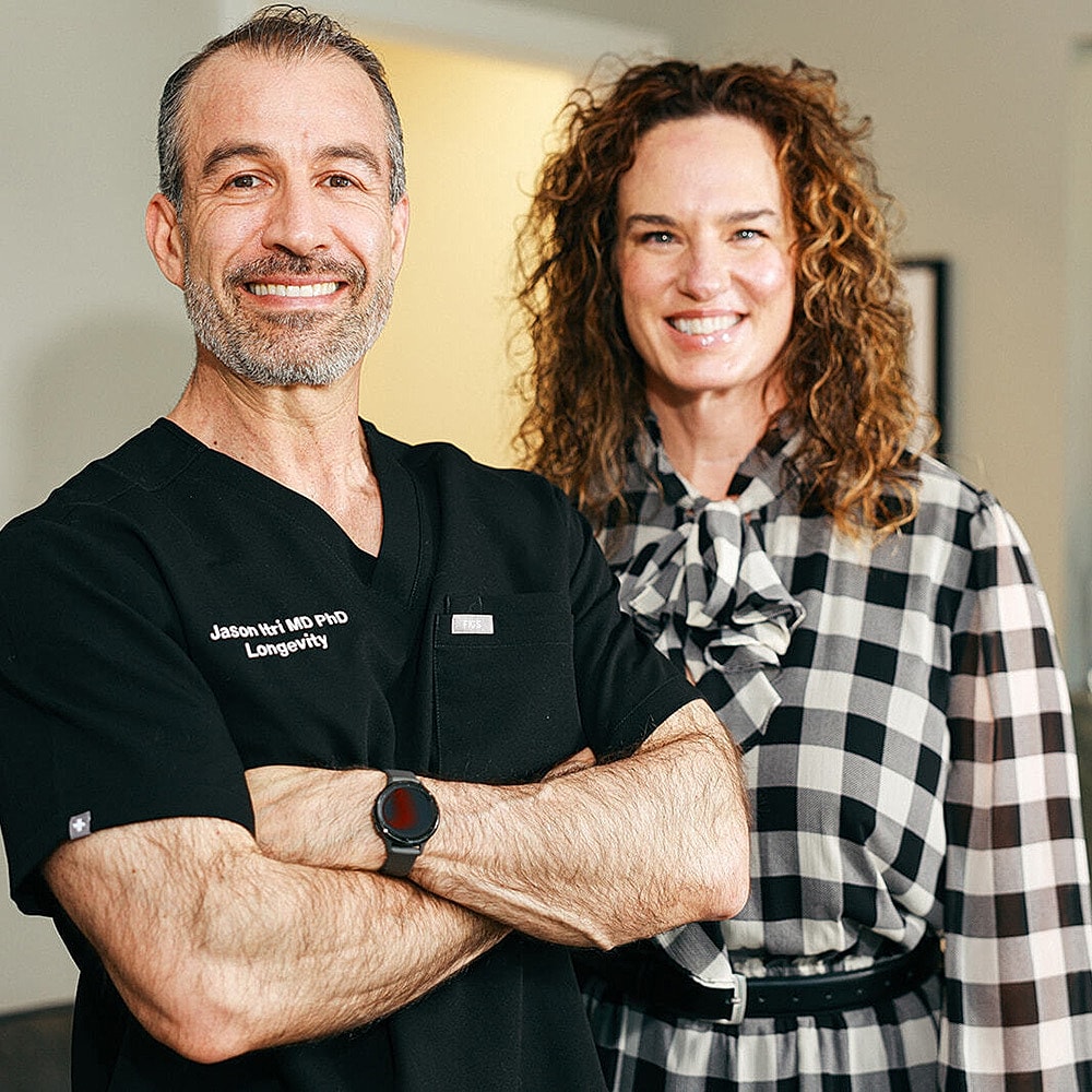 Healthcare professionals smiling in an office setting.